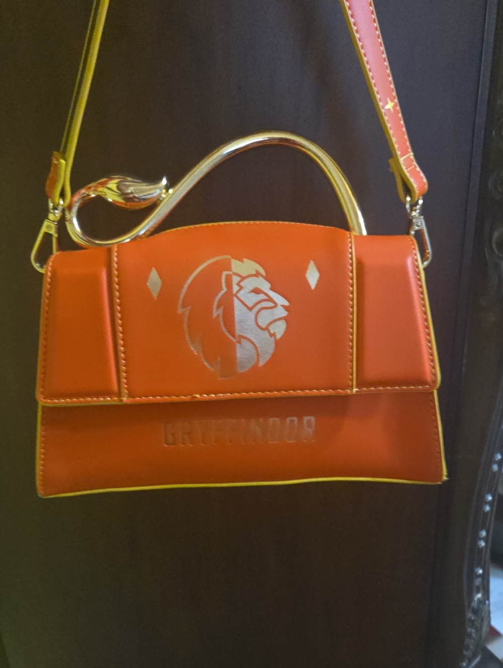 Gryffindor Orange Crossbody Bag with Gold Leo Tail Handle
